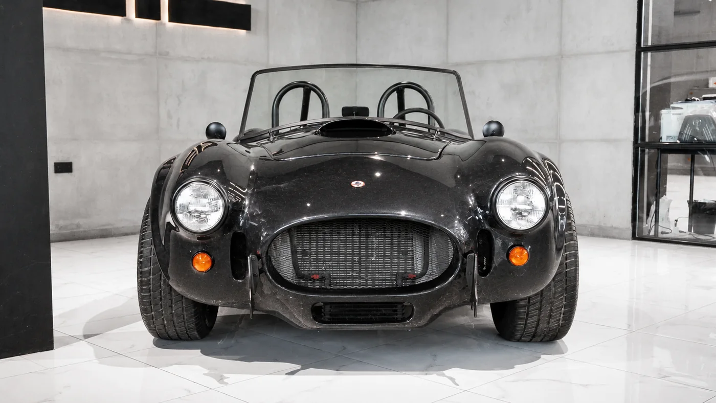 Ford Cobra in a plain black finish before repaint