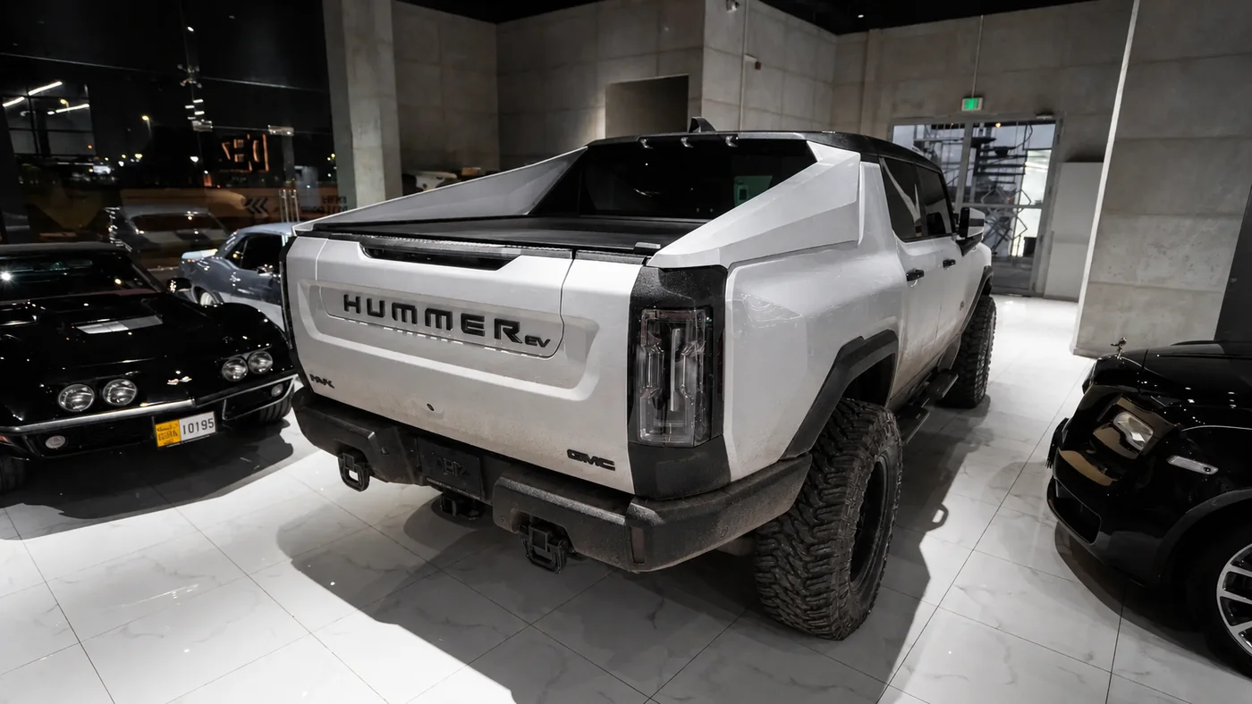 GMC Hummer EV in a plain white factory-style finish before repaint