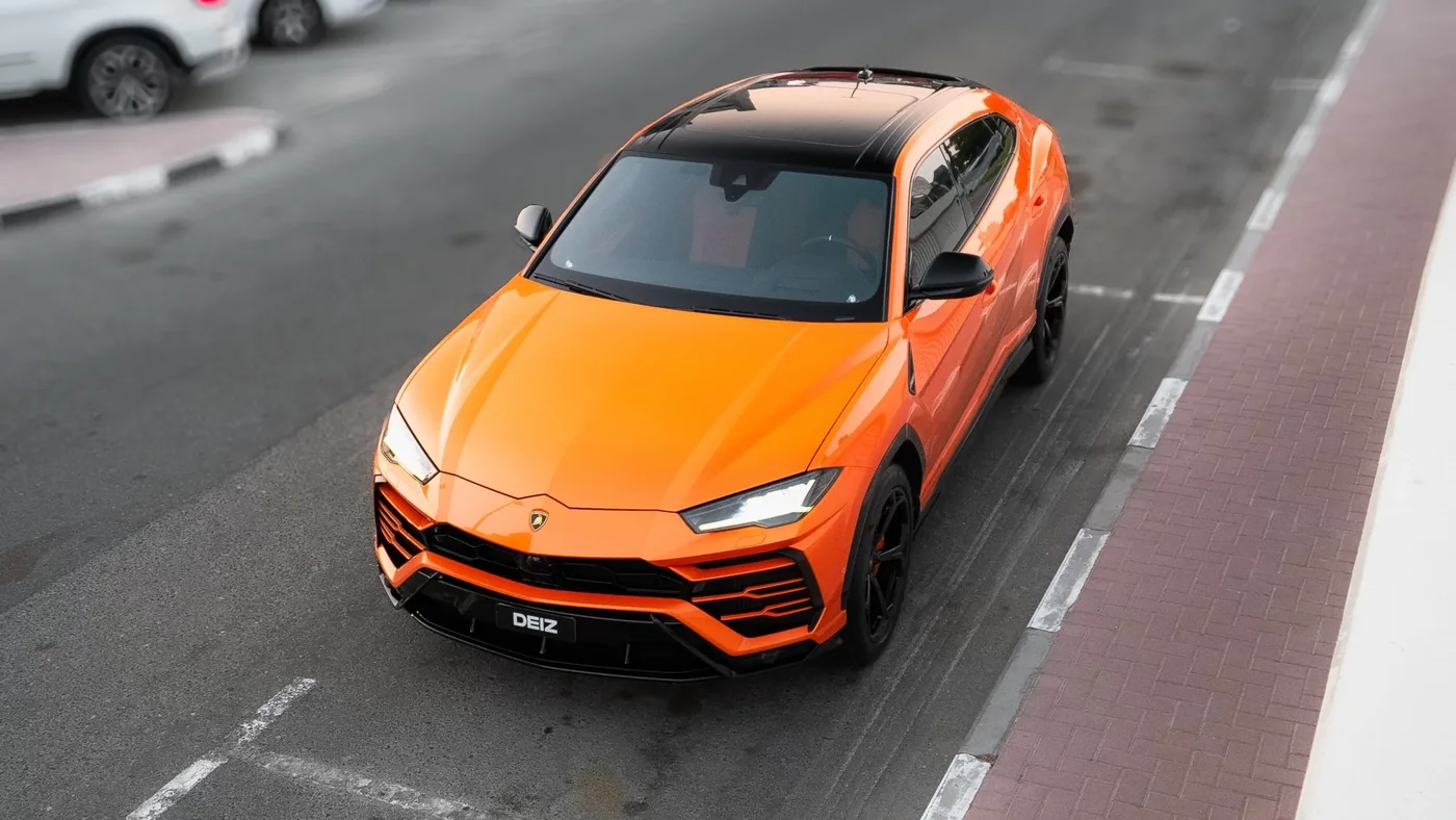 Lamborghini Urus after repaint in bright orange at DEIZ