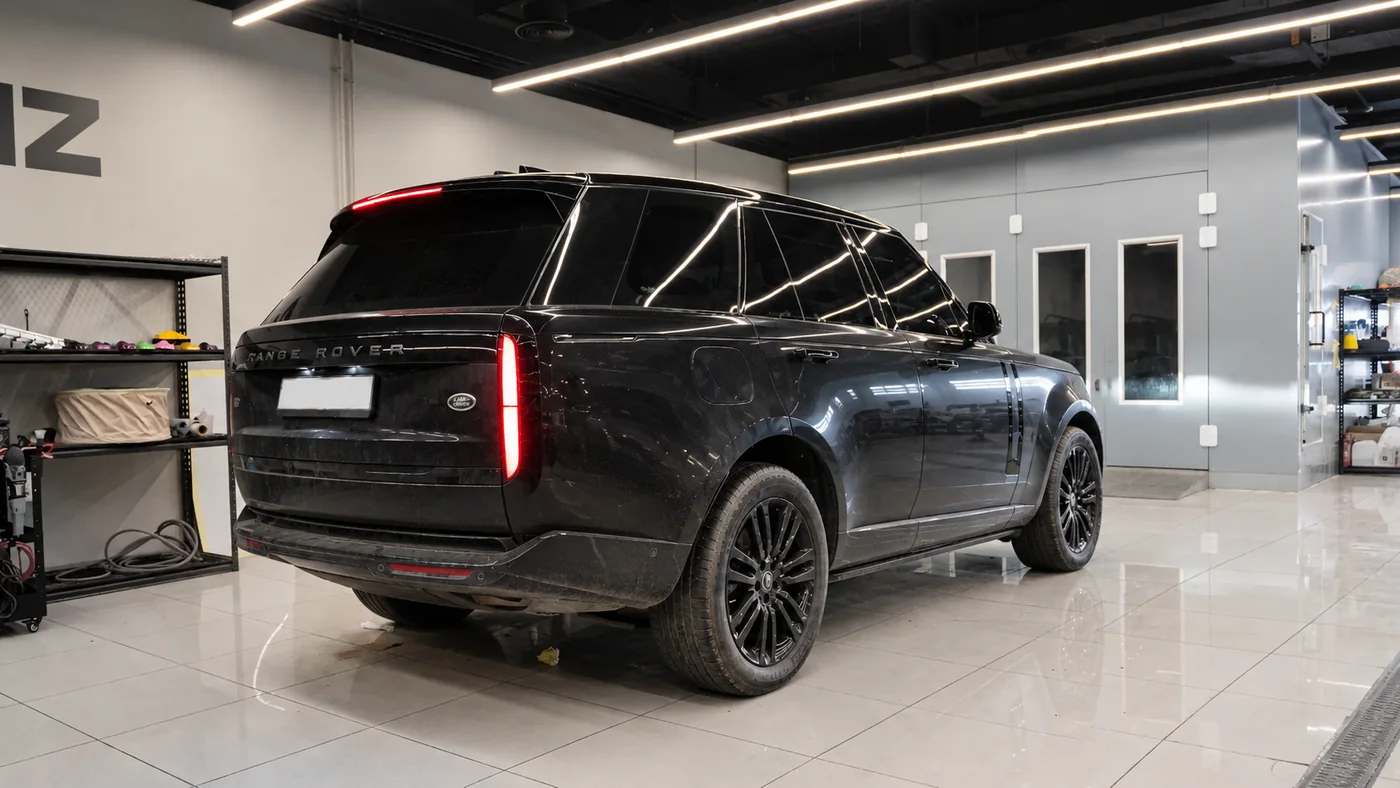 Range Rover before repaint in a dark standard finish